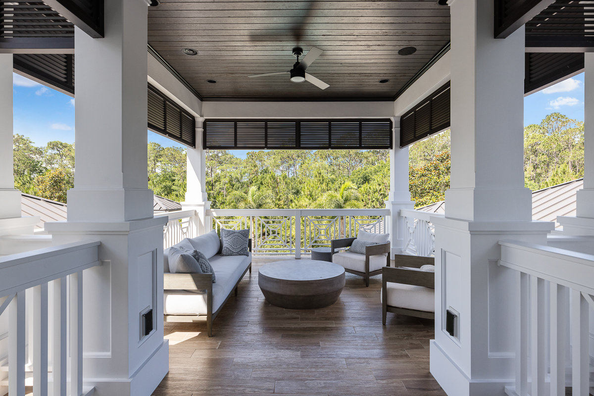 balcony with white railing and patio furniture